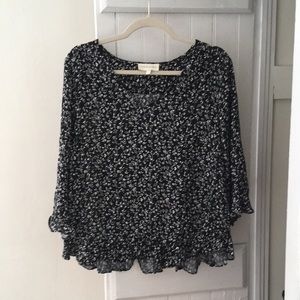 Black with white floral detail quarter sleeve top